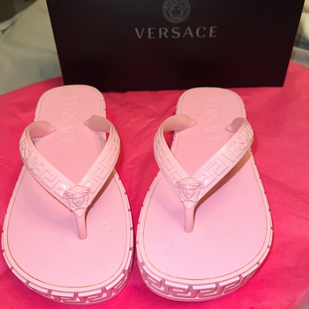 Versace
Greca-embossed flip flops